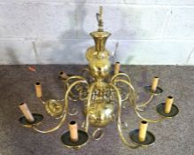 Two vintage Flemish style brass chandeliers, one with six lights, 80cm diameter, 60cm high; the