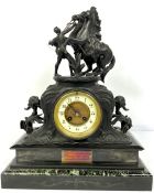 A Victorian spelter mantle clock, surmounted by two horses and their groom, 45 cm high