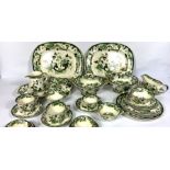 A large and comprehensive Mason’s Ironstone dinner service, Chartreuse pattern, decorated with green