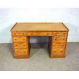 A Victorian satin birch kneehole desk, late 19th century, with a three quarter galleried rectangular