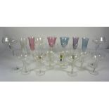 Assorted glassware, including seven pale pastel coloured glasses, a set of four goblets with