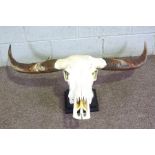 An Indian Wild Ox skull and horns with stand, 108cm wide