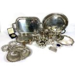 A large assortment of silver plate, including various trays, serving dishes, a three-piece tea