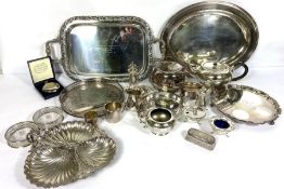 A large assortment of silver plate, including various trays, serving dishes, a three-piece tea