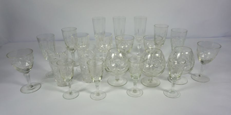 A large assortment of Stuart and other crystal glassware, including Champagne flutes, whisky tots