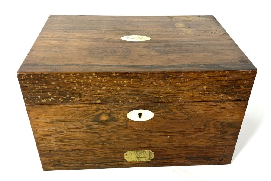 A William IV rosewood travelling box, the interior with assorted compartments and fittings for