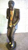 A novelty carved and painted plaster ‘New Orleans’ style jazz band figure group, including a