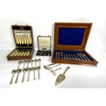A large assortment of silver plated flatware together with a cased set of fruit eaters, and other