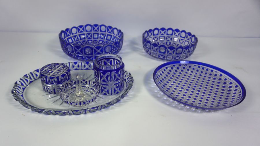 A selection of Continental blue flashed and cut crystal glassware, including two matching