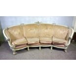 A very large curved four seat settee, with painted and moulded frame, light pink floral