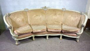 A very large curved four seat settee, with painted and moulded frame, light pink floral