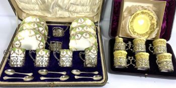 A Royal Worcester six place coffee service, with silver holders, hallmarked London 1894, in a fitted