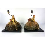 A pair of Capodimonte style Art Deco table lamps, each set with a seated lady holding a rose, both