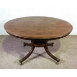 A George IV mahogany breakfast table, circa 1825, with a circular tilt top, set on a pedestal with