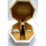 A cased Bulova ladies cocktail watch, model 60 70 07, 18 carat gold case, with certificate and outer