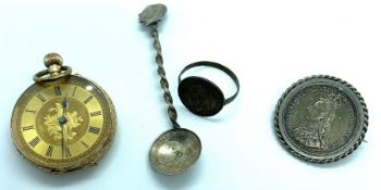 A small 14 carat gold cased fob watch, 32mm diameter, with a yellow metal watch chain, and
