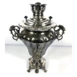 A electroplated Samovar, of lobed and waisted form , with removable top and scrolled and pierced