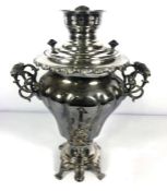 A electroplated Samovar, of lobed and waisted form , with removable top and scrolled and pierced