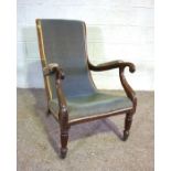 A George IV mahogany Library armchair, circa 1825, with a gently sloping scrolled back and arms,