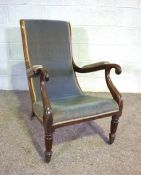 A George IV mahogany Library armchair, circa 1825, with a gently sloping scrolled back and arms,