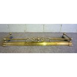 A Victorian brass fire curb, with ball corner points and central foliate scroll crest, 120cm wide