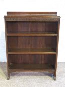 A small open front oak bookcase, circa 1930, with three shelves, 98cm high, 76cm wide