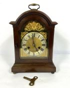 George III style table clock, circa 1900, in an arch top case, with a silvered chapter ring, the