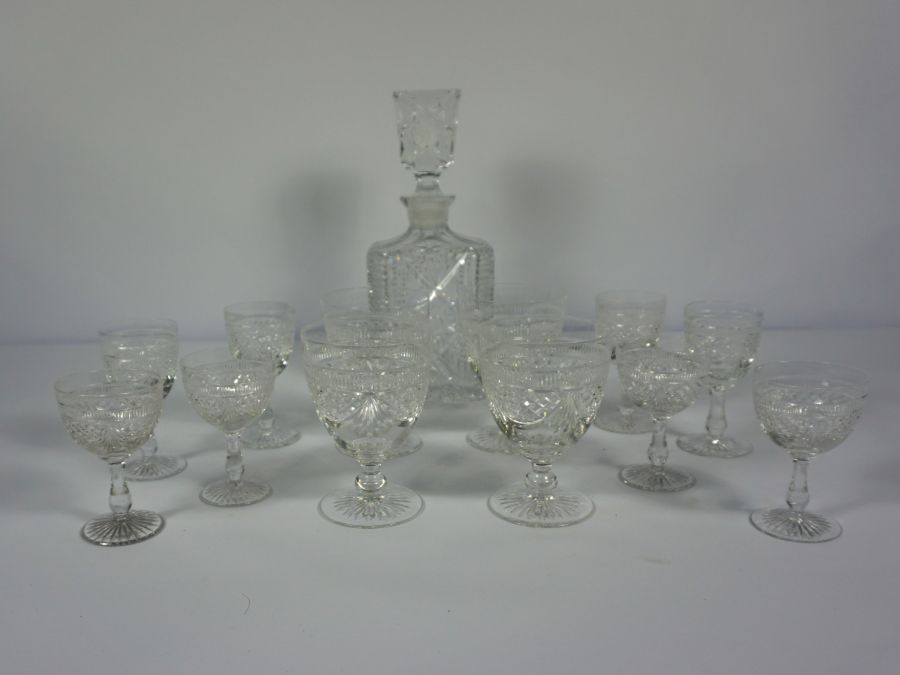 A large set of crystal glassware, including red and white wine goblets, water glasses and an