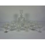 A large set of crystal glassware, including red and white wine goblets, water glasses and an