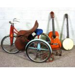 A small leather saddle with wrought iron saddle rack and bridle rack; together with a small child’