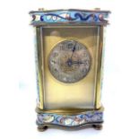 A French brass and enamel carriage timepiece, circa 1900, with circular silvered dial and Roman