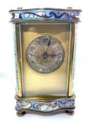 A French brass and enamel carriage timepiece, circa 1900, with circular silvered dial and Roman