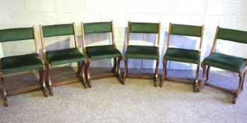 A set of six green upholstered music room chairs, with scroll supports (6)