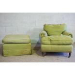 A deep seated armchair, in the manner of Howard & Sons, 20th century, together with a footstool,