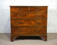 A George III style mahogany veneered chest of drawers, 20th century, with two short and three long