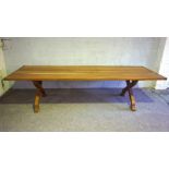 A large and substantial oak refectory dining table, 20th century, with a wide rectangular planked