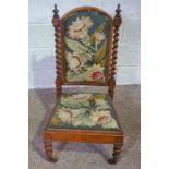 A Victorian tapestry upholstered nursing chair, together with a footstool (2)