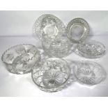 A large assortment of table glassware and other decorative cut glass bowls, decanters and other