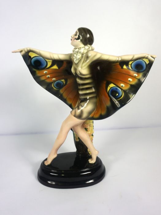 A Goldsheider ceramic painted figure of The Butterfly Girl, after Josef Lorenzl, base stamped 5230 /