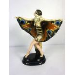 A Goldsheider ceramic painted figure of The Butterfly Girl, after Josef Lorenzl, base stamped 5230 /