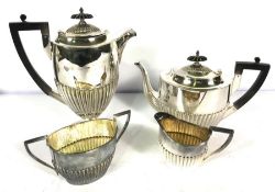 A four piece silver plated tea service, by Walker & Hall, of typical part fluted form, stamped 'Hard