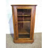 A small Victorian walnut veneered pier cabinet, late 19th century, with boxwood stringing and a