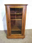 A small Victorian walnut veneered pier cabinet, late 19th century, with boxwood stringing and a