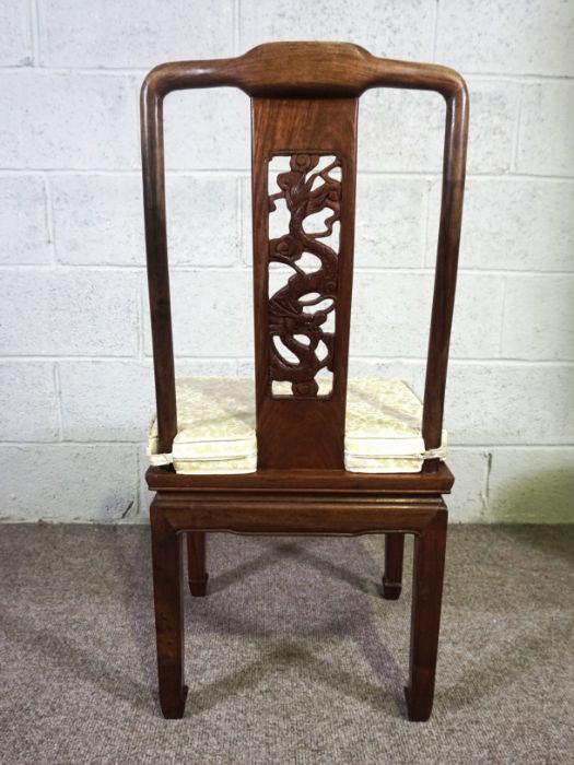 A Chinese hongmu or hardwood dining suite, including an extending oval dining table, and a set of - Image 5 of 14