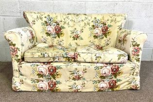 A small two seat upholstered sofa, currently upholstered with floral decoration, 135 cm wide