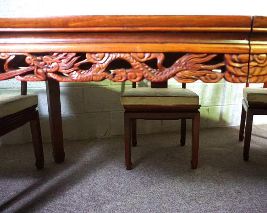 A Chinese hongmu or hardwood dining suite, including an extending oval dining table, and a set of - Image 12 of 14