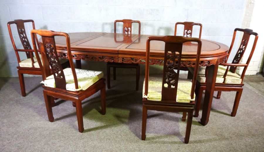 A Chinese hongmu or hardwood dining suite, including an extending oval dining table, and a set of - Image 2 of 14