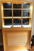 A modern cherry veneered Jewellers shop display cabinet, with a glazed top, fitted with shelves