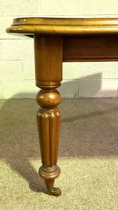 A Victorian mahogany extending dining table, with additional leaves set on for ring tanned and lobed - Image 3 of 3