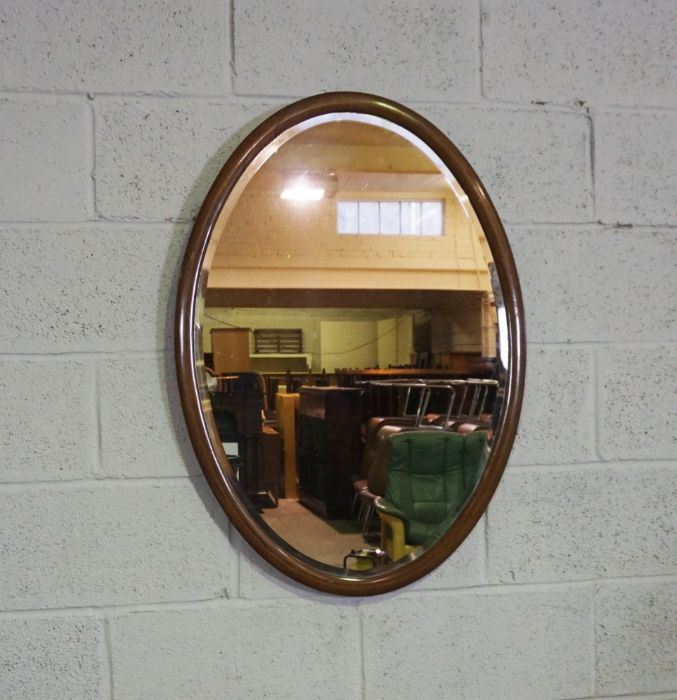 An Edwardian oval mirror on stand, with carved supports, 73cm high, 82cm wide; and another oval - Image 6 of 10